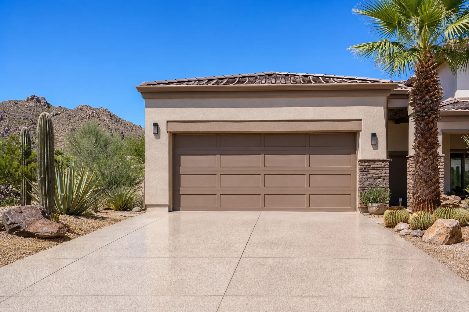 Full exterior view of an Arizona home's garage door in direct sunlight, showing how Arizona heat affects your garage door